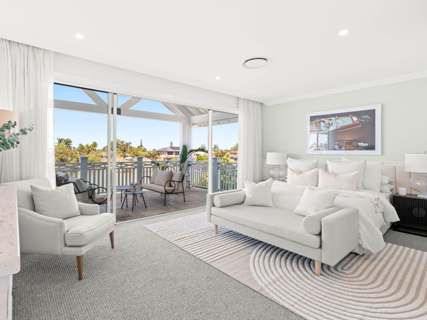 Bedroom styled with Slim Aarons photography artwork for hire in Benowa Waters Canal Front House