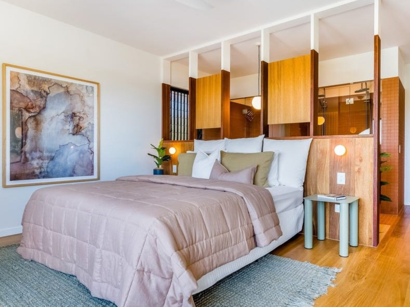 Bedroom styled with neutral abstract artwork for hire in Byron Bay Townhouse